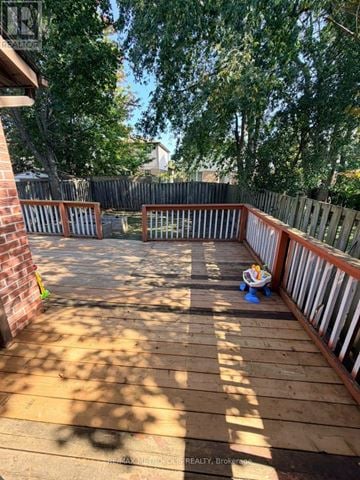 Ajax (Central) apartment for rent - A wooden deck with a child's toy on it.