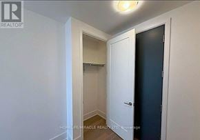 Toronto (Playter Estates-Danforth) condo for rent - A white door is open to a dark room.