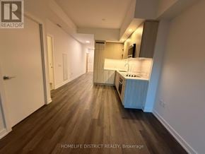 Vaughan (Vaughan Corporate Centre) condo for rent - A long, narrow apartment with wood flooring and white walls.
