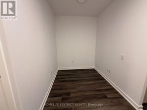 Vaughan (Vaughan Corporate Centre) condo for rent - A room with wooden flooring and white walls.