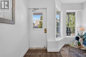 St. Catharines (E. Chester) apartment for rent - A white door with a glass window is in the middle of a room.