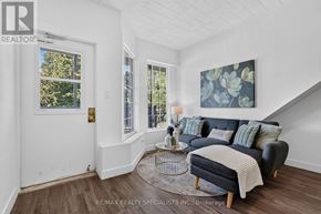 St. Catharines (E. Chester) apartment for rent - A living room with a couch, a coffee table, and a painting on the wall.