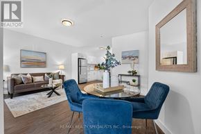 St. Catharines (E. Chester) apartment for rent - A living room with a blue chair and a brown couch.
