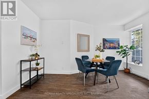 St. Catharines (E. Chester) apartment for rent - A dining room with a table set for four and a plant on the side table.