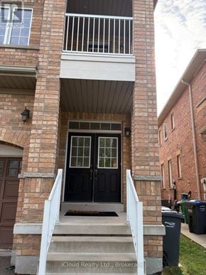 Mississauga (Hurontario) apartment for rent - A black door is on the left side of a white railing.