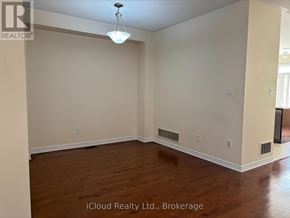 Mississauga (Hurontario) apartment for rent - A room with wooden floors and a ceiling light.