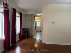 Mississauga (Hurontario) apartment for rent - A room with a wooden floor and white walls, with a bar stool and a door visible.