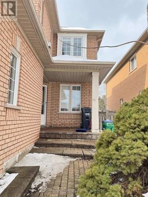 Mississauga (Central Erin Mills) apartment for rent - A red brick house with a white door and windows.
