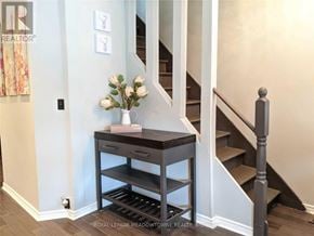 Hamilton (Gibson) apartment for rent - A staircase with a table and drawers underneath it.