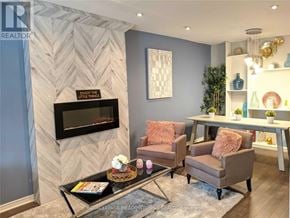 Hamilton (Gibson) apartment for rent - A living room with a grey couch, a coffee table, and a fireplace.