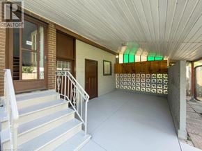 Niagara Falls apartment for rent - A house entrance with a staircase leading to the door.