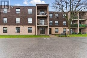 Lincoln (Beamsville) condo for rent - Apartment building with a sign that says "Royal LePage".