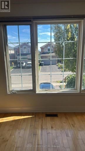 Mississauga (Cooksville) apartment for rent - A window with a view of a street and houses outside.