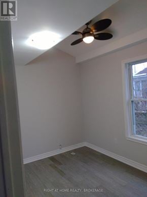 St. Catharines (Downtown) duplex for rent - A room with a ceiling fan and a window.