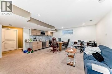 Calgary apartment for rent - A living room with a blue couch and a dining table with chairs.