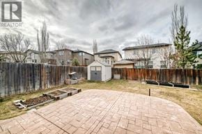 Calgary apartment for rent - A backyard with a brick patio and a wooden fence.