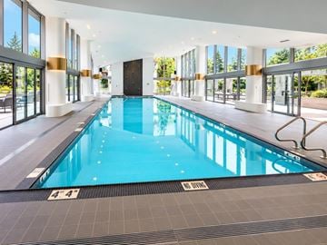 Surrey apartment for rent - A large indoor swimming pool with a "No Diving" sign.