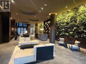 Toronto (Mount Pleasant West) condo for rent - A modern waiting area with a green wall and comfortable seating.