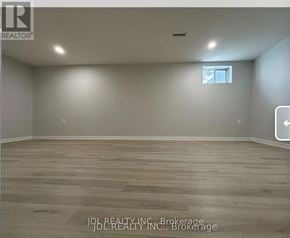 Toronto (Pleasant View) apartment for rent - A room with wooden flooring and a window with a white frame.