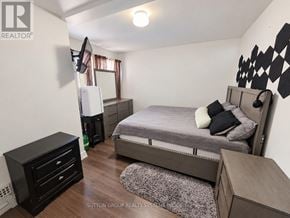 Toronto (Keelesdale-Eglinton West) townhouse for rent - A bedroom with a bed, dresser, and a TV.