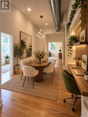 Toronto (South Riverdale) apartment for rent - A well-lit, modern dining room with a wooden table and chairs.