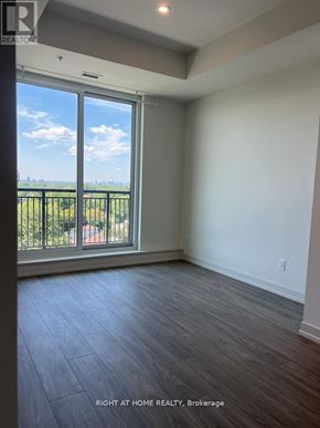 Toronto (Birchcliffe-Cliffside) condo for rent - A room with a large window overlooking a balcony.