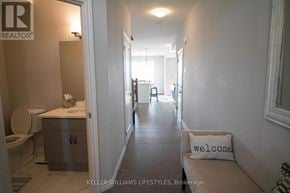 London North (North I) townhouse for rent - A hallway with a welcome pillow on the bench.