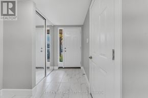 London South (South Y) townhouse for rent - A hallway with white doors and a tiled floor.