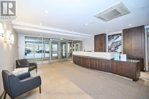 Toronto (Cabbagetown-South St. James Town) condo for rent - A real estate office with a reception desk and chairs.