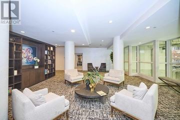 Toronto (Cabbagetown-South St. James Town) condo for rent - A living room with a large rug and a coffee table.
