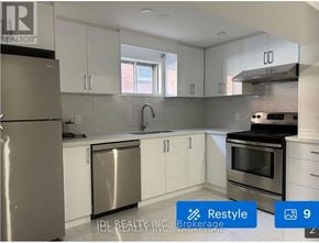 Toronto (Pleasant View) apartment for rent - A modern kitchen with stainless steel appliances and white cabinets.