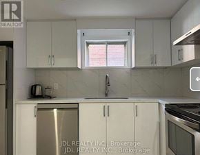 Toronto (Pleasant View) apartment for rent - A kitchen with white cabinets and a stainless steel refrigerator.