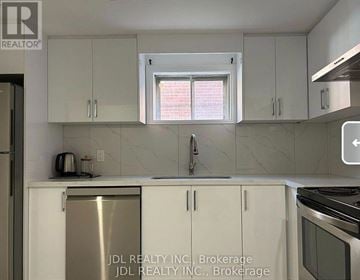 Toronto (Pleasant View) apartment for rent - A kitchen with white cabinets and a stainless steel refrigerator.