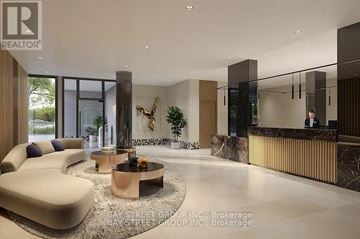 Oshawa (Windfields) condo for rent - A modern living room with a curved sofa and a coffee table in the center.