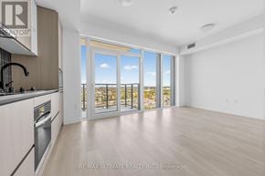 Toronto (Dovercourt-Wallace Emerson-Junction) condo for rent - A spacious kitchen with a view of the outdoors through large windows.