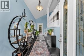 Lasalle apartment for rent - A hallway with a rug and a chandelier.