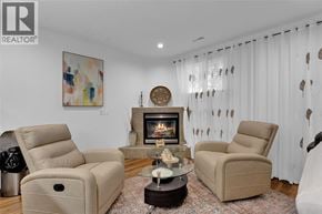 Lasalle apartment for rent - A living room with a fireplace and two chairs.