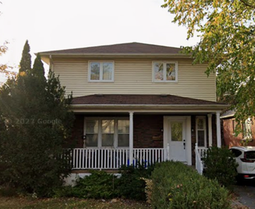 Kingston apartment for rent - A house with a white door and a small porch.