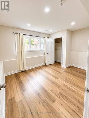 Orillia apartment for rent - A room with wooden flooring and white walls.