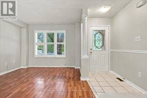 Oakville (Wt West Oak Trails) townhouse for rent - A room with wooden floors and a white door.