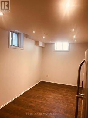 Mississauga (Central Erin Mills) apartment for rent - A room with wooden flooring and two windows.