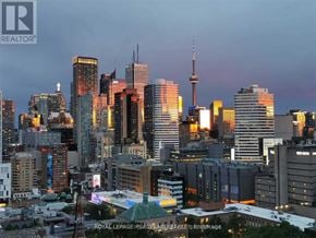Toronto (Church-Yonge Corridor) condo for rent - A cityscape at dusk with the CN Tower prominently lit up.