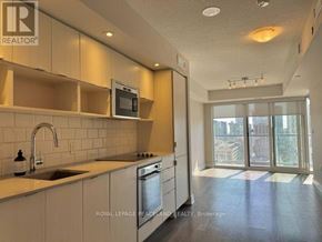Toronto (Church-Yonge Corridor) condo for rent - A kitchen with a sink, stove, and microwave.