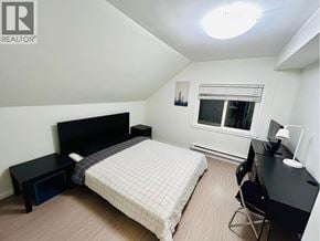 Vancouver apartment for rent - A bedroom with a bed, desk, and chair.