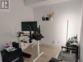 Toronto (Moss Park) condo for rent - A room with a desk, chair, and computer setup.