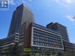 Toronto (Henry Farm) condo for rent - A tall building with a sign that says "FreshCo" in front of it.