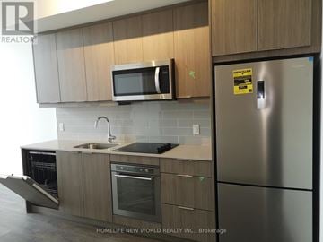 Toronto (Henry Farm) condo for rent - A modern kitchen with wooden cabinets and stainless steel appliances.