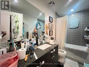 Toronto (Casa Loma) condo for rent - A bathroom with a sink, toilet, and shower.