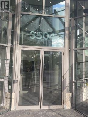 Mississauga (City Centre) condo for rent - The glass door of a building with the number 3504 written on it.