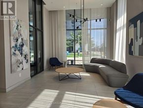 Toronto (Islington-City Centre West) condo for rent - A modern living room with a large window and a view of the outdoors.